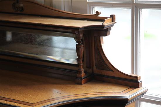 Lamb of Manchester. A Victorian Aesthetic movement ebony strung golden oak bookcase, W.3ft 11in. D.1ft 4in. H.4ft 6in.